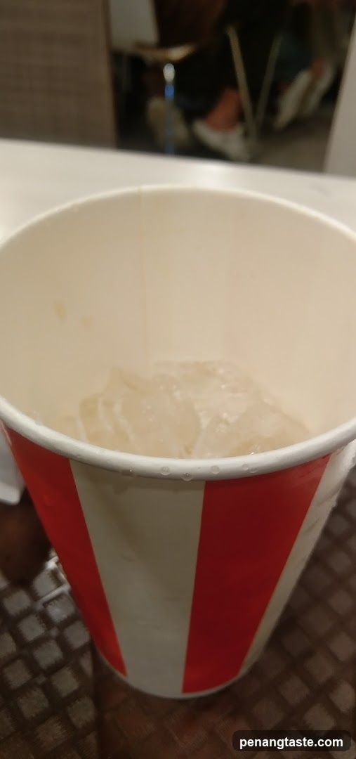 Red and white striped cup with ice