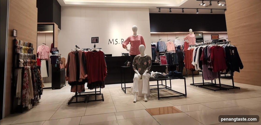 Clothing store interior with mannequins and apparel