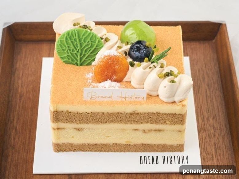 Square cake with fruit and cream decoration