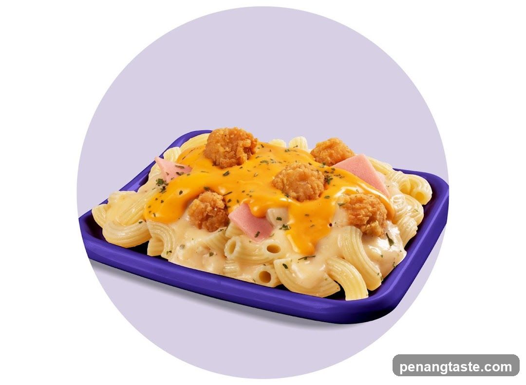 Macaroni with cheese sauce and fried chicken bites