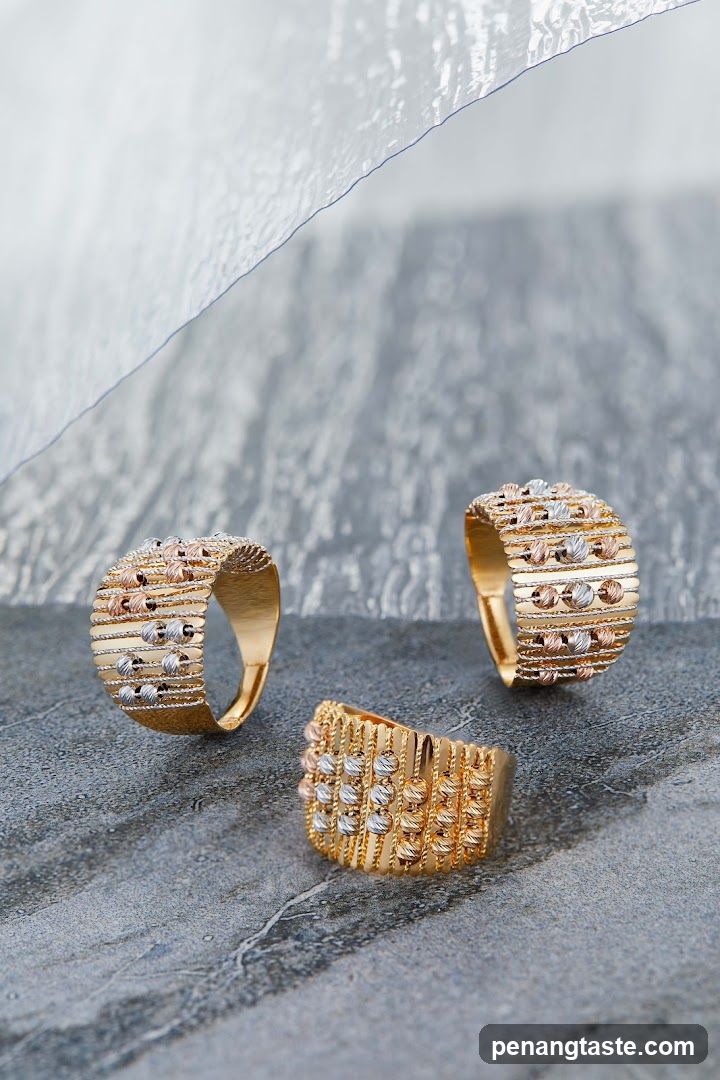 Three gold rings with beaded details