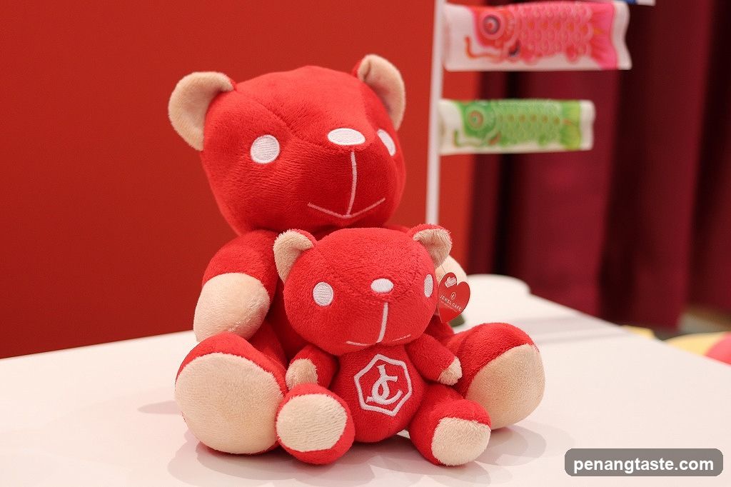 Two red teddy bears