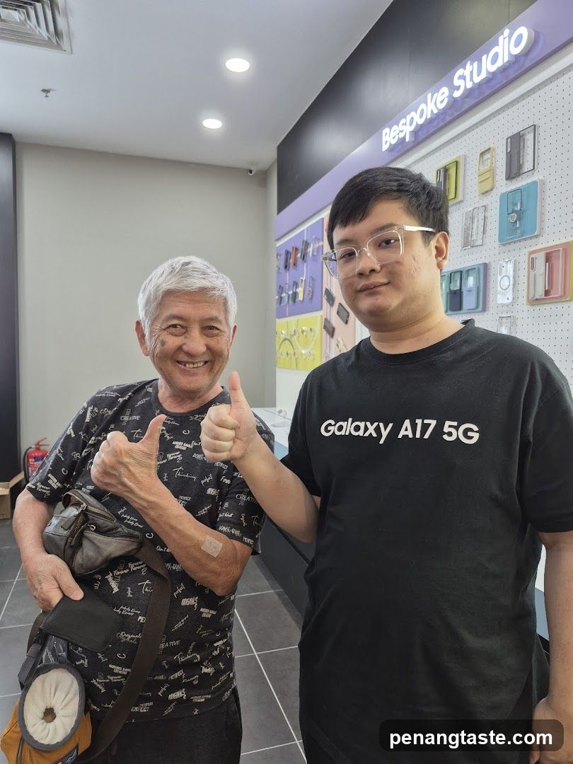 Two men giving thumbs up in a store