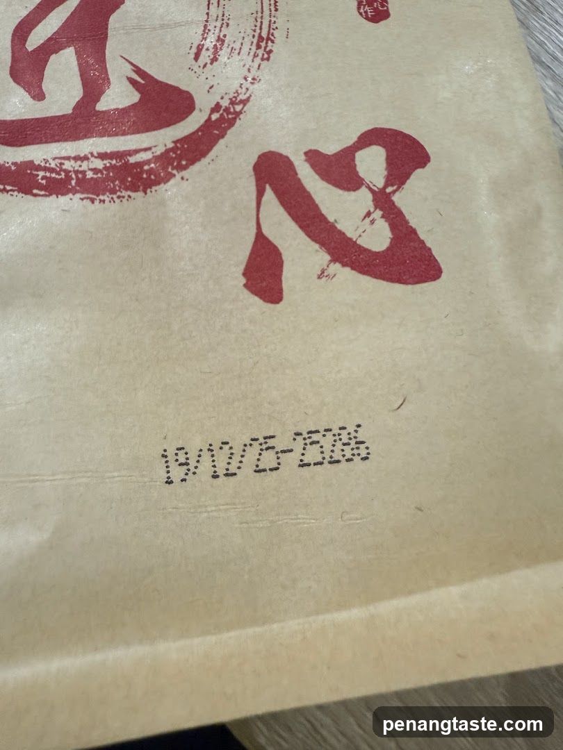 Brown Paper Bag with Red Calligraphy and Date Stamp