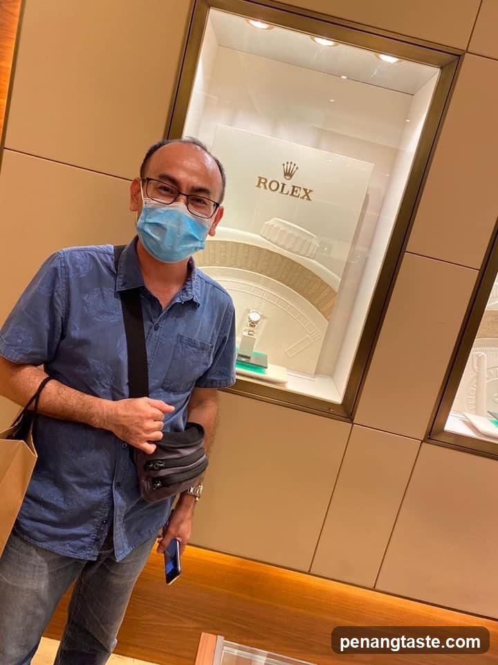 Man in front of Rolex display