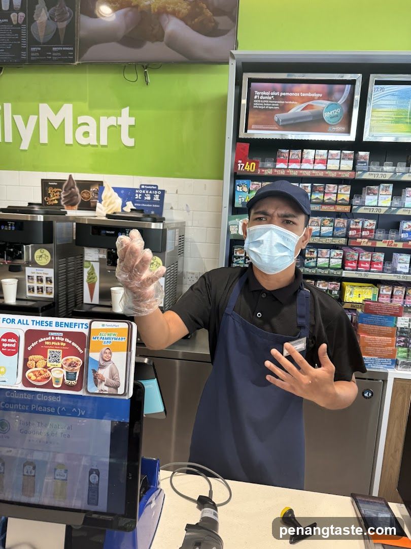 FamilyMart Employee at Counter