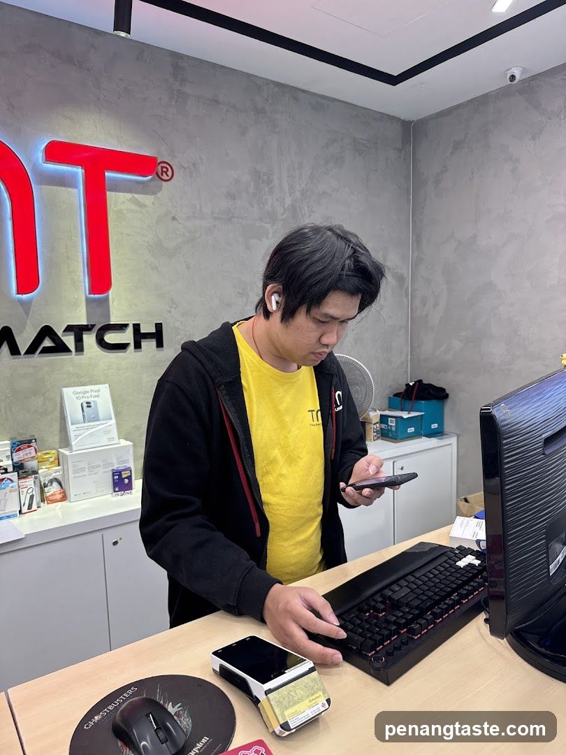 Man at a counter with electronics