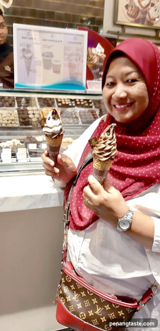 Woman holding Godiva ice cream cones
