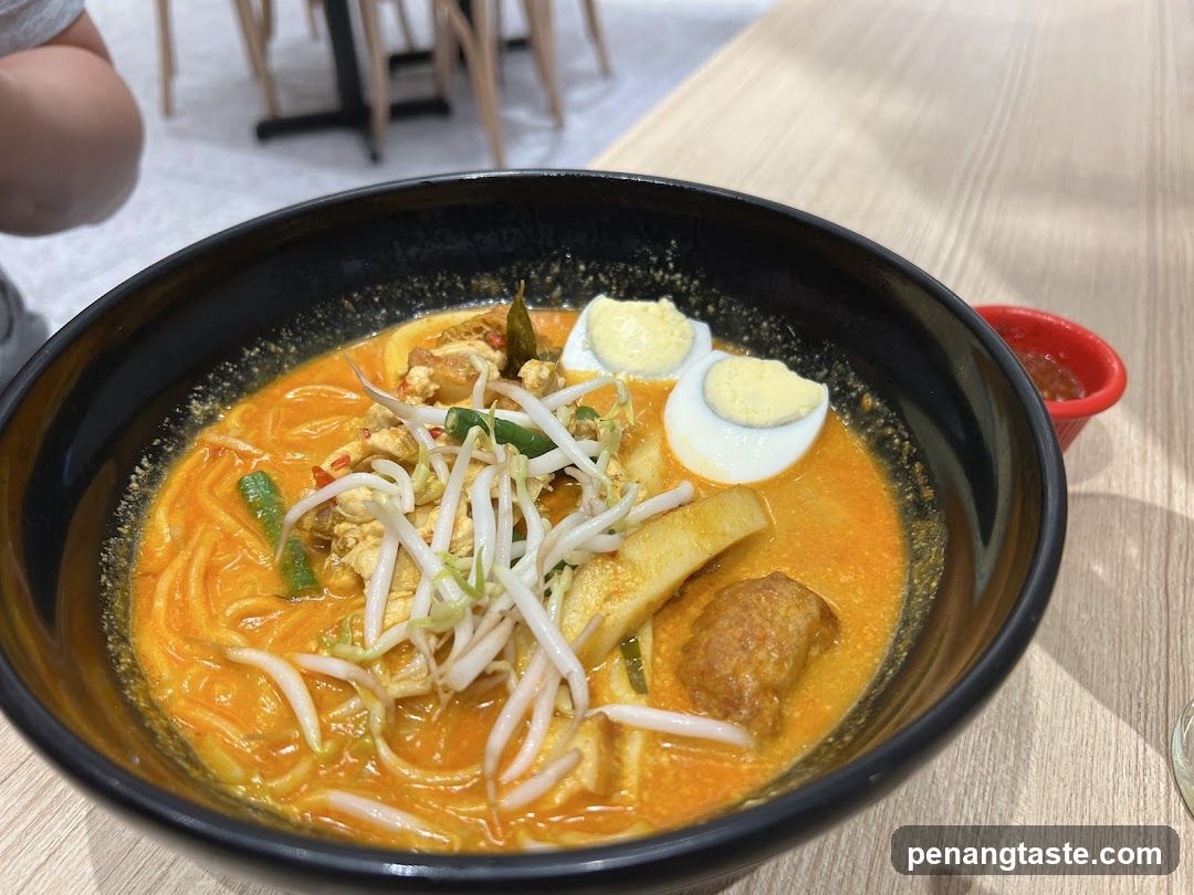Laksa bowl in restaurant interior