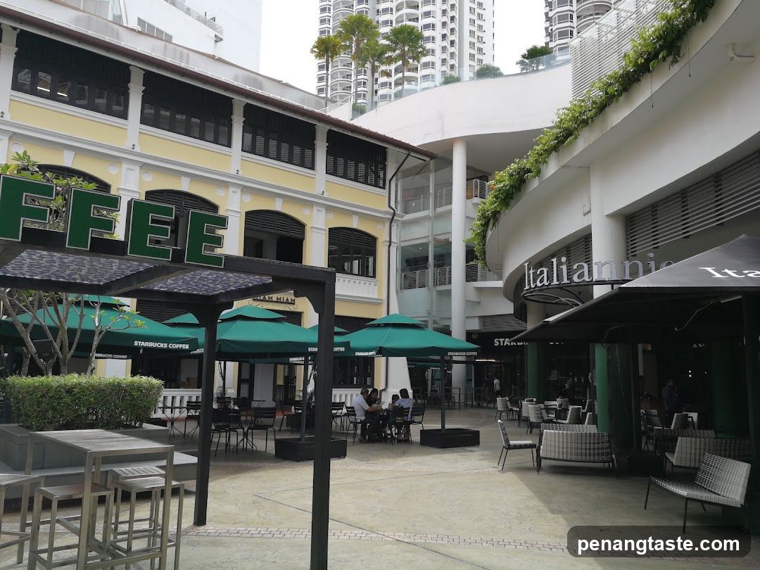 Outdoor seating area with Starbucks and Italian restaurant