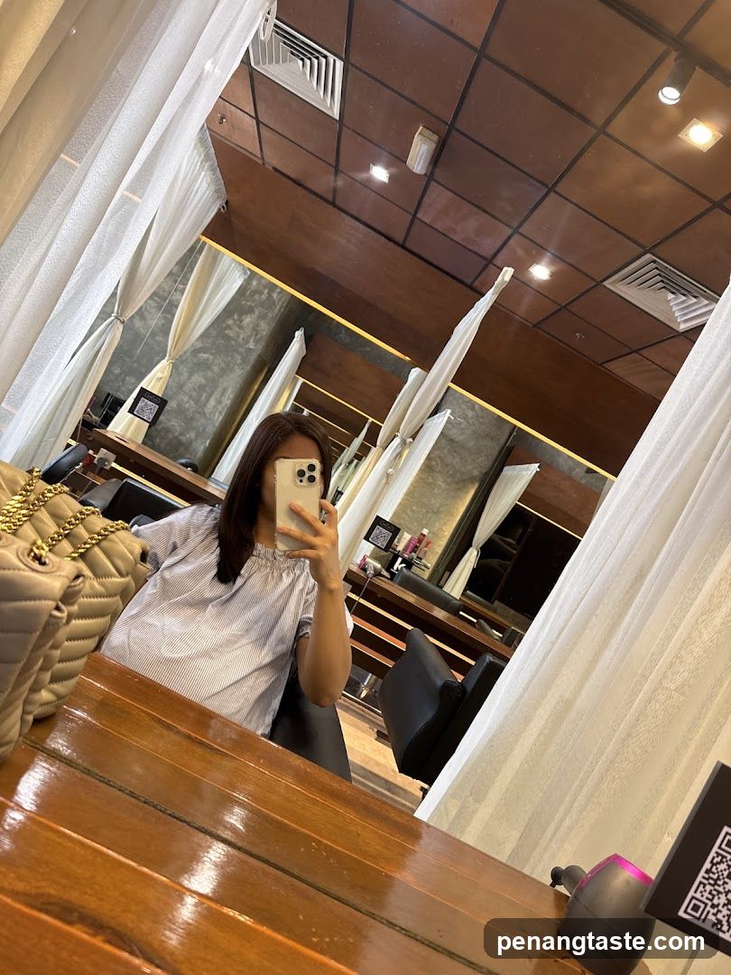 Woman taking a selfie in a salon