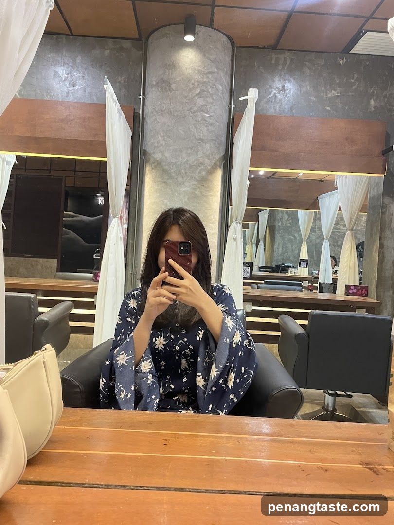 Woman taking a selfie in a salon