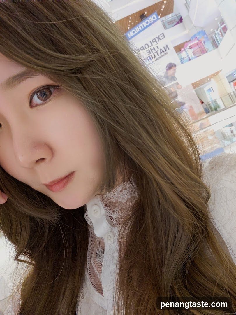 Woman in a white lace-trimmed blouse