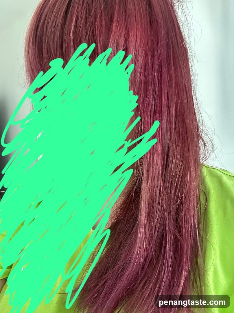 Woman with pink-toned hair