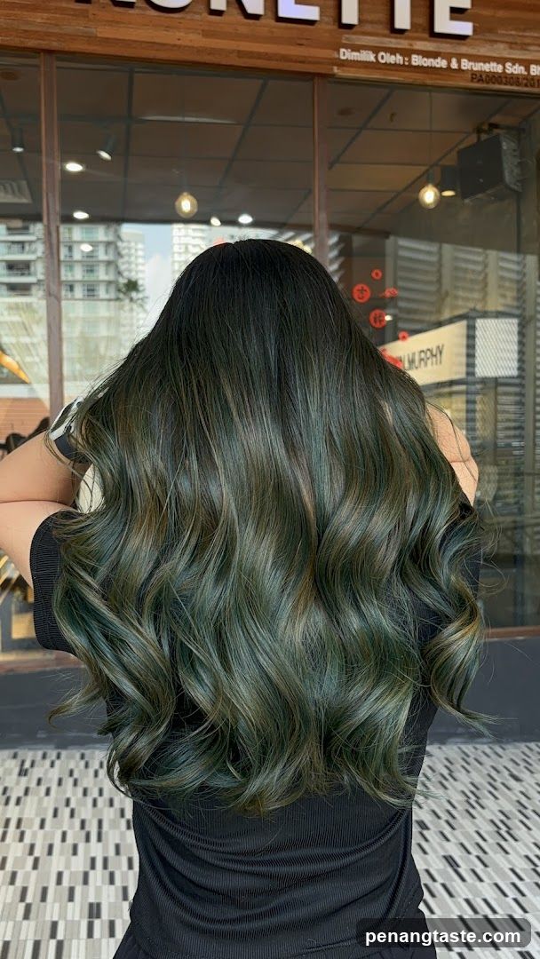 Woman with dark green wavy hair