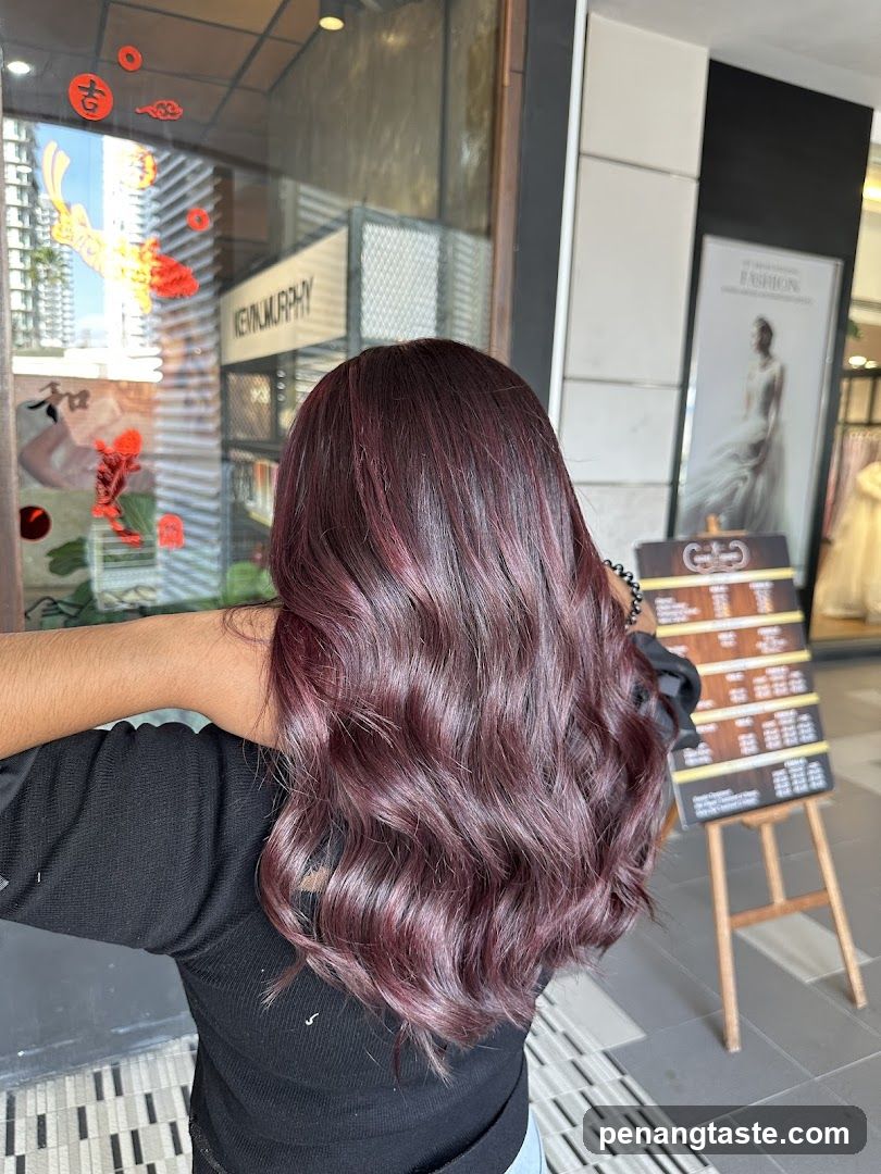 Woman with Burgundy Hair in Front of Salon