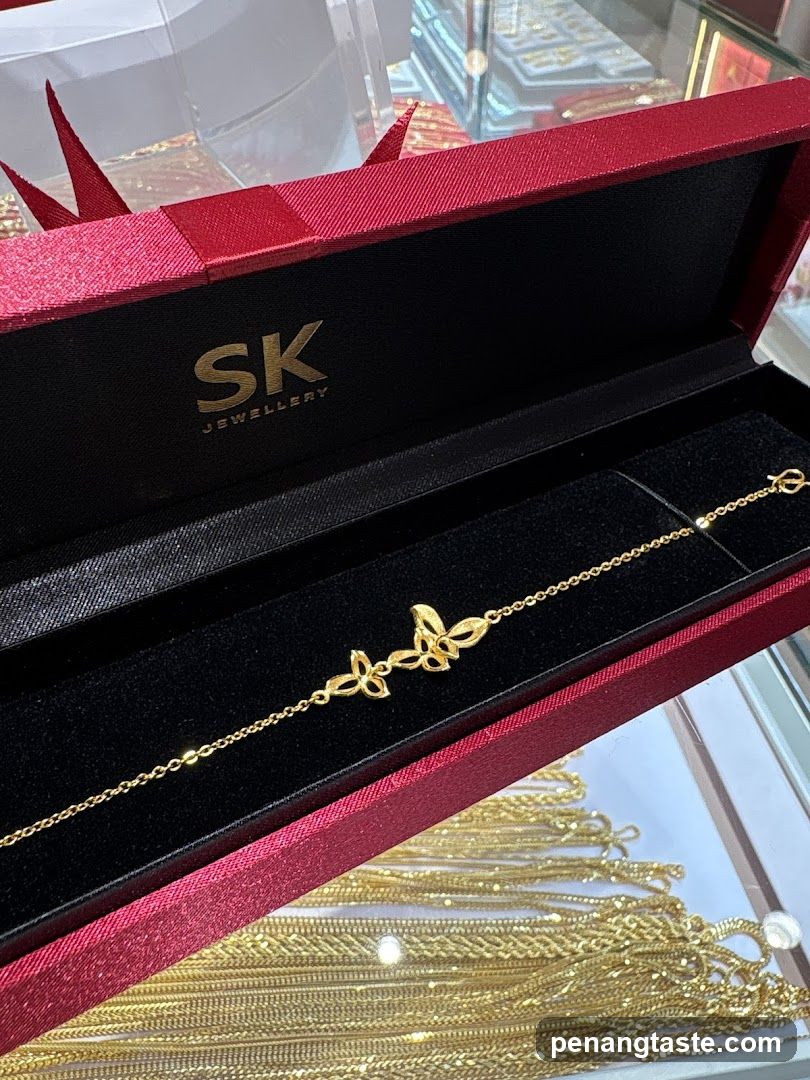 Gold bracelet with butterfly design