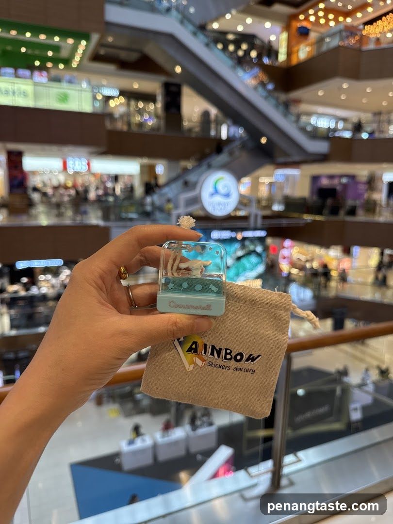 Hand holding a small decorative item with a pouch
