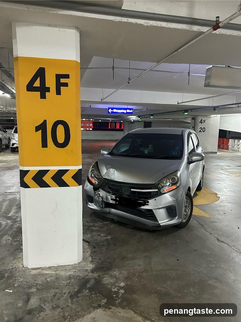 Damaged car in parking lot
