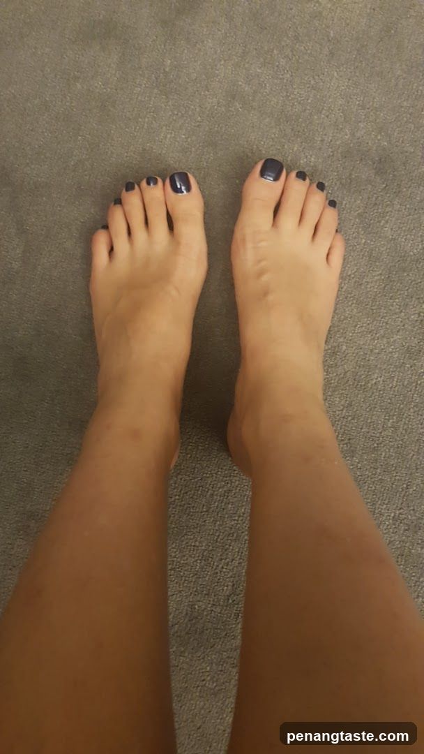 Feet with dark nail polish