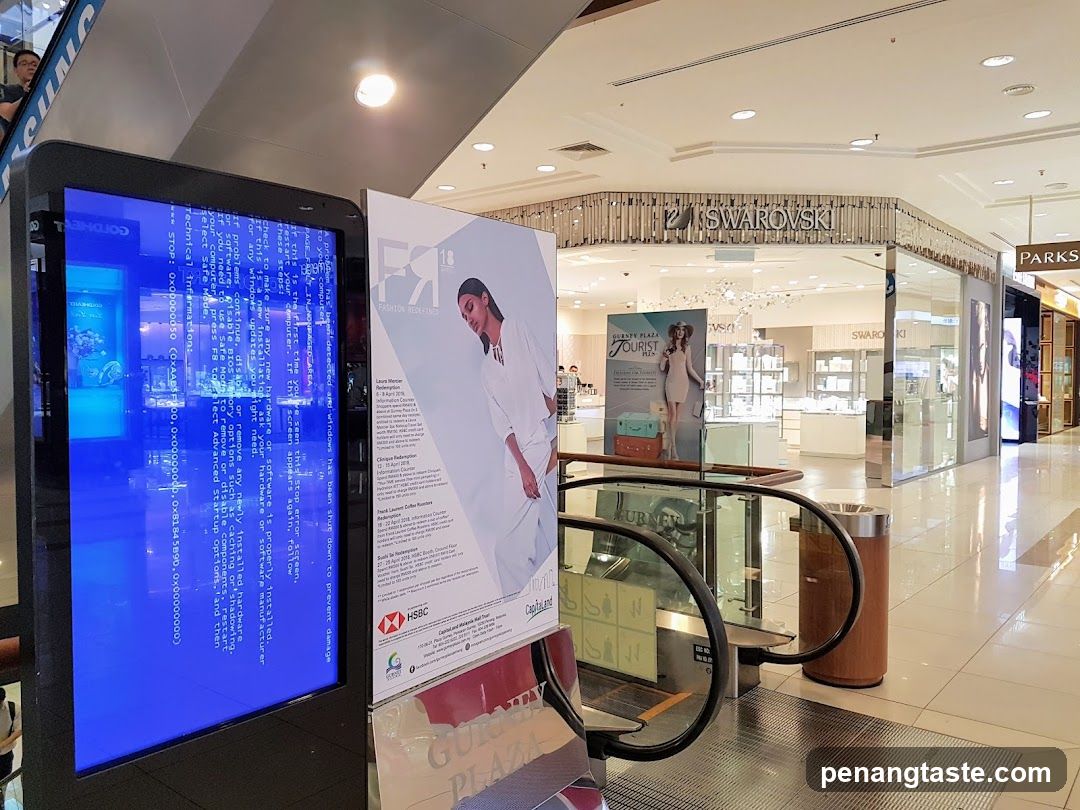 Mall Interior with Digital Display and Storefronts
