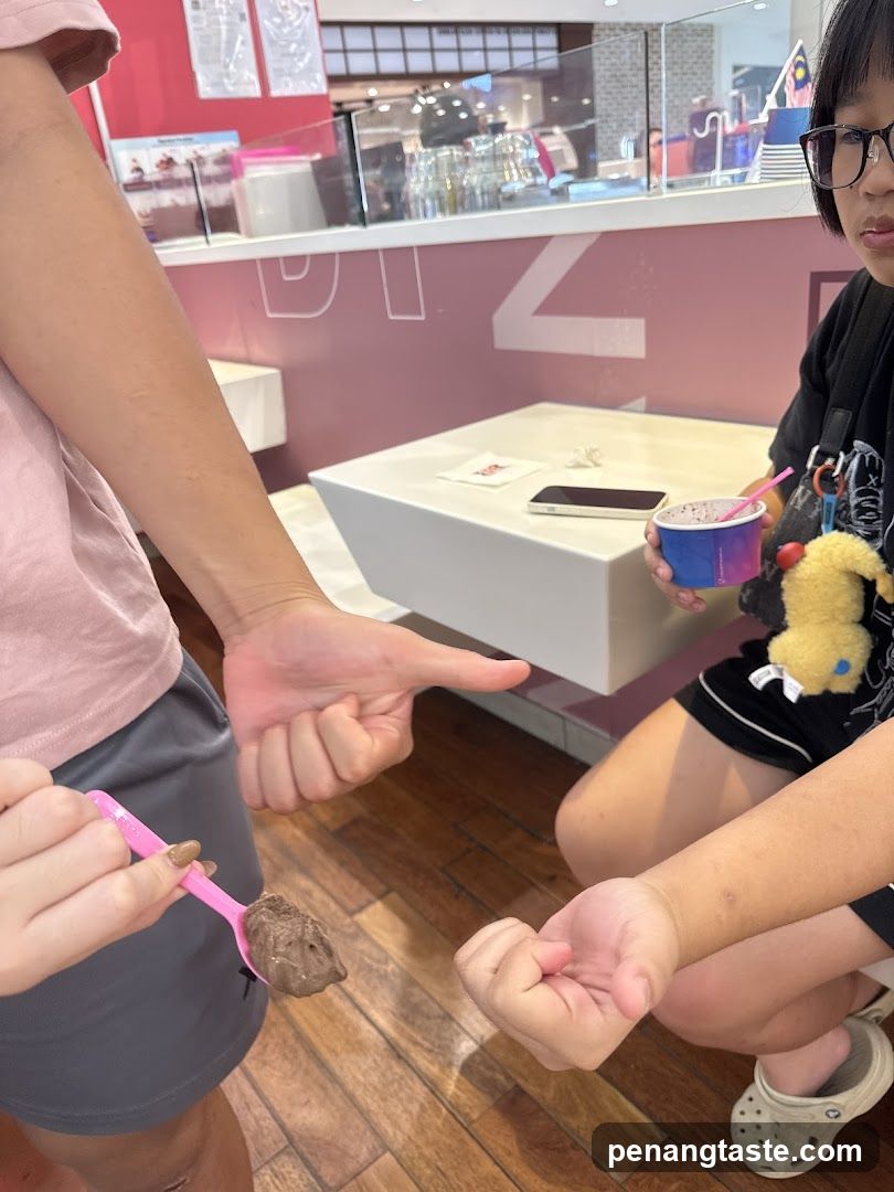 People enjoying ice cream at a counter