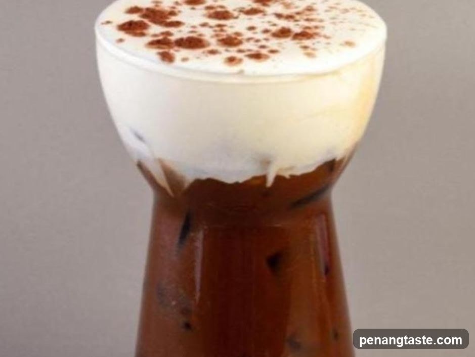 Iced Coffee with Cream and Cocoa Powder