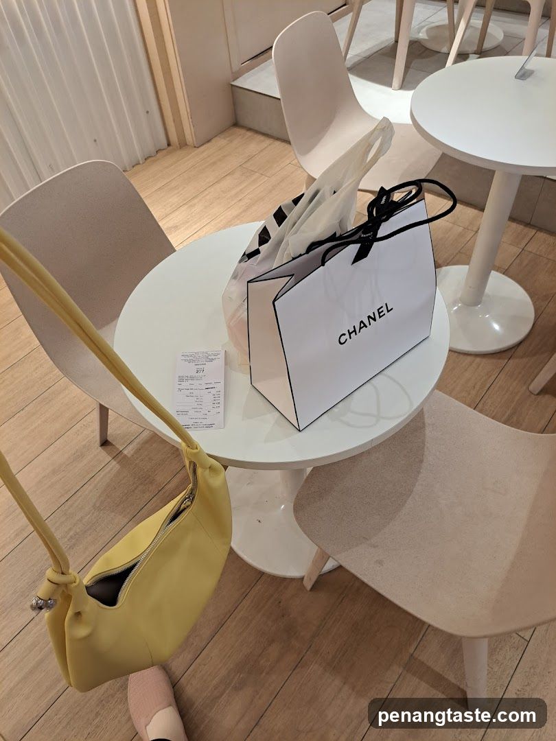 Chanel Shopping Bag and Receipt on Table
