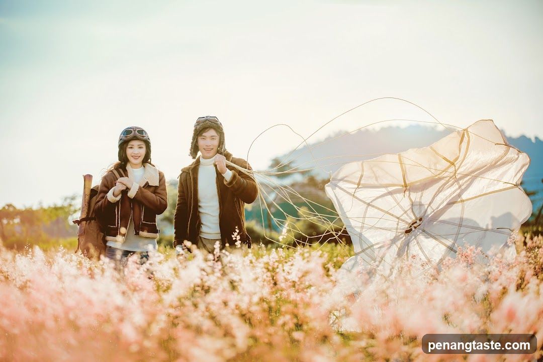 Couple in Aviator Outfits with Parachute