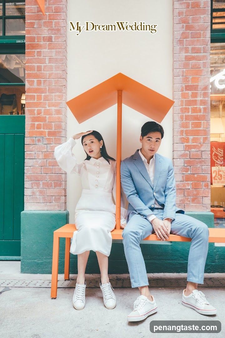 Couple Posing Under Orange Structure
