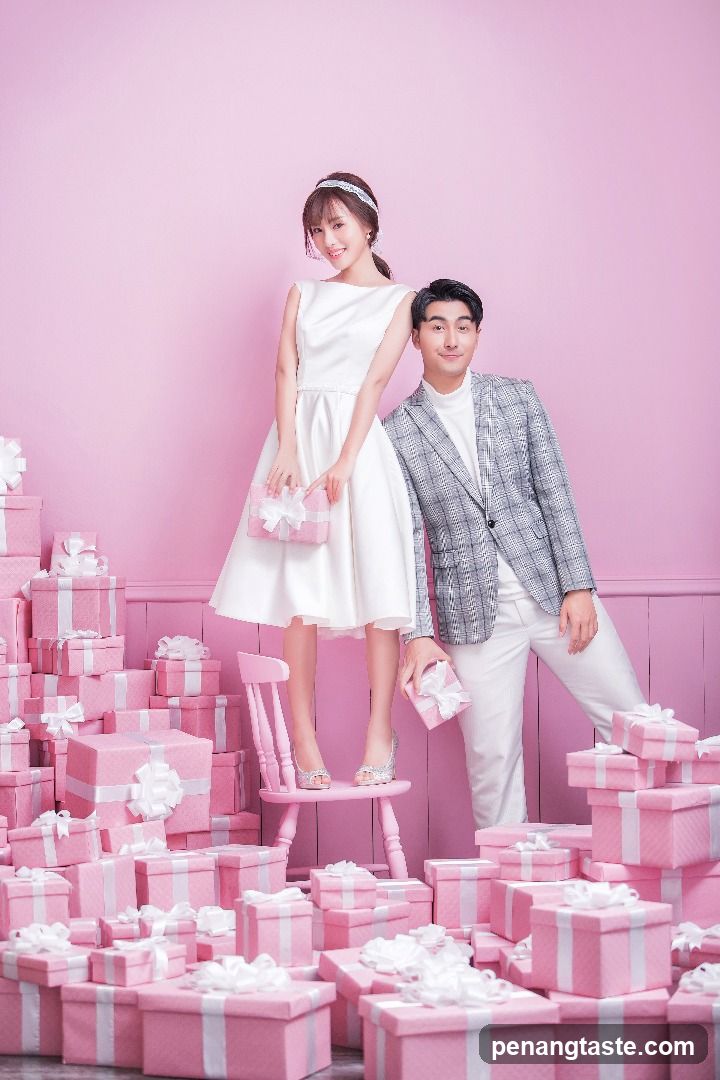 Couple Posing with Pink Gift Boxes