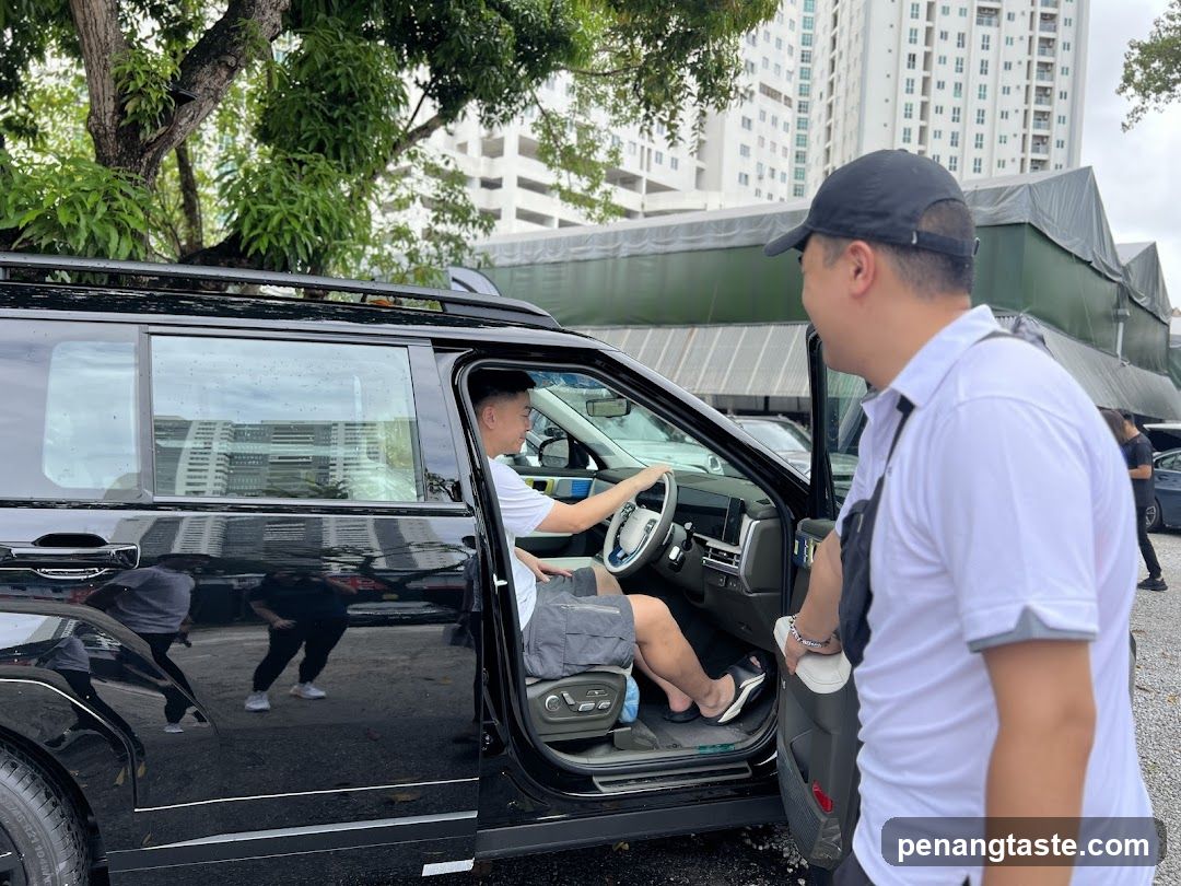 Two men by a car