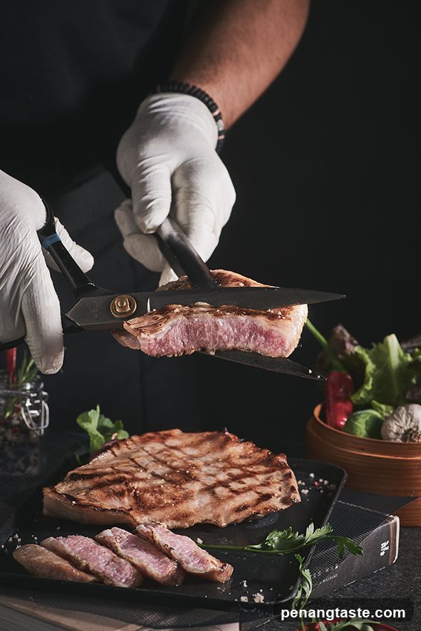 Chef preparing steak
