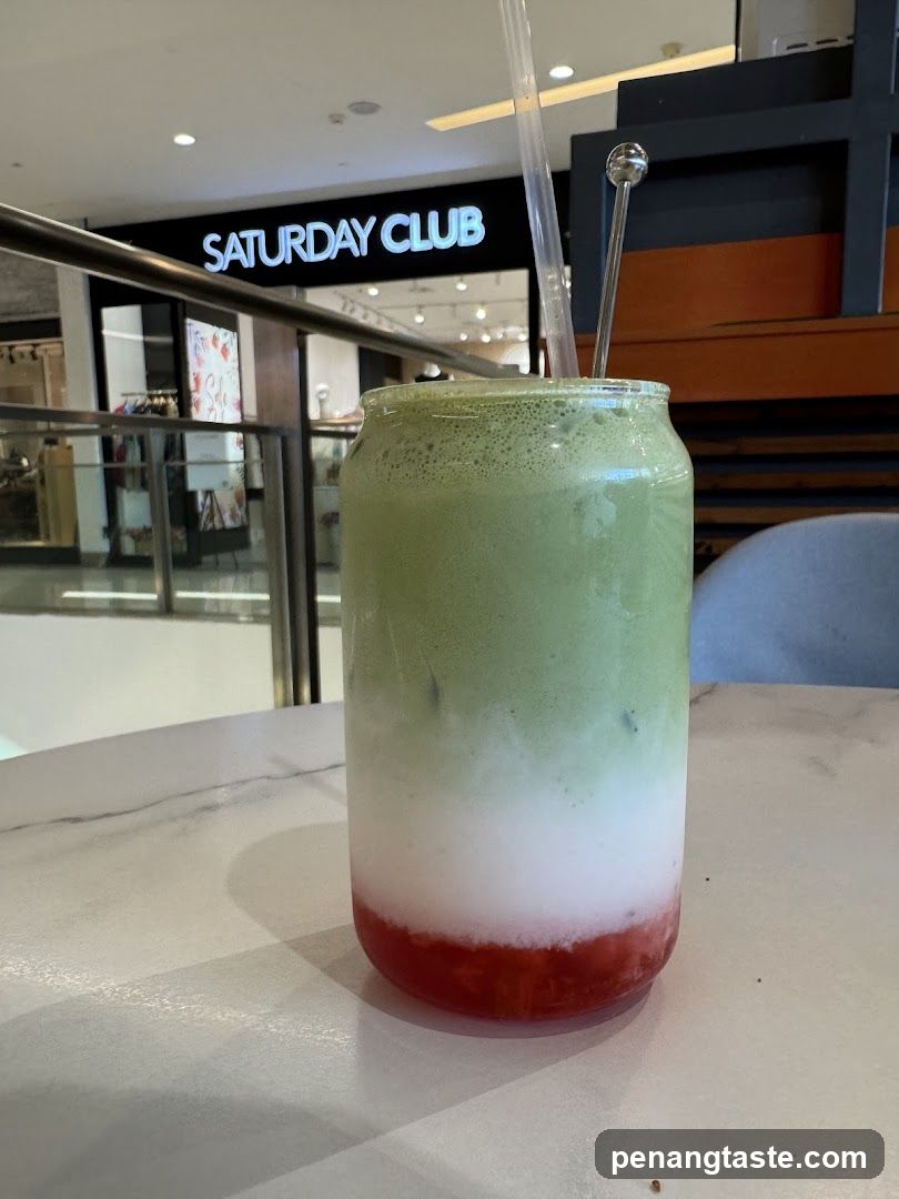 Layered Drink with Storefront in Background
