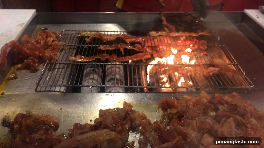 Bacon Cooking on a Grill