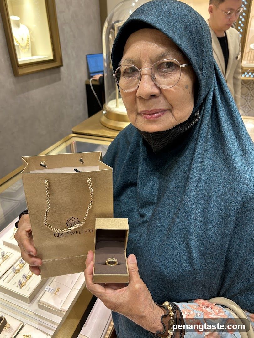 Woman holding a ring and shopping bag