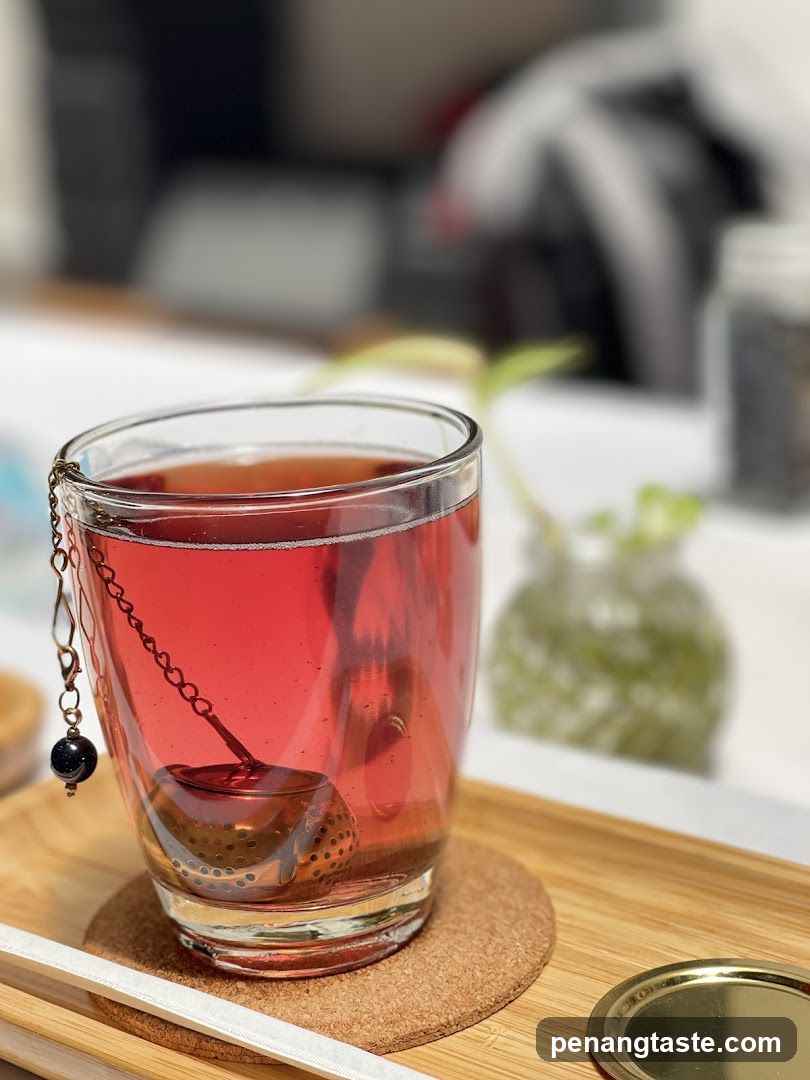 Glass of Red Tea with Tea Infuser