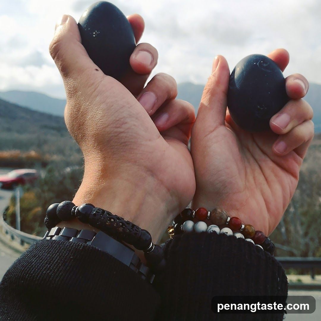 Hands holding black eggs