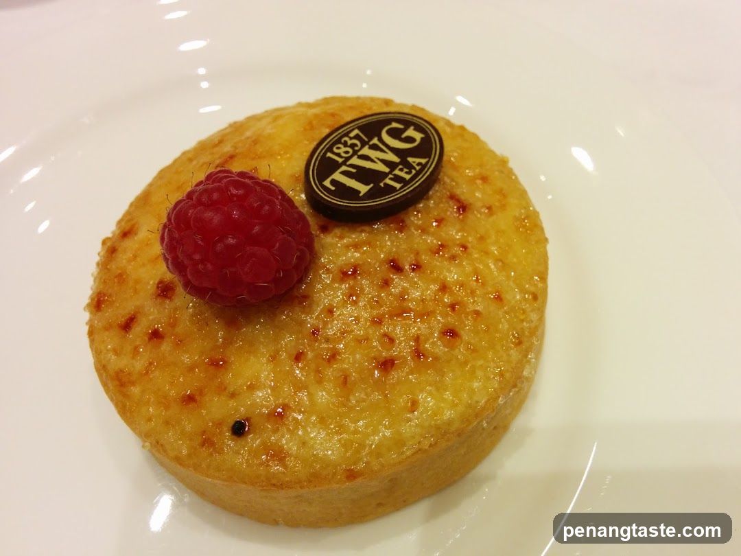 Dessert with Raspberry and TWG Tea Logo