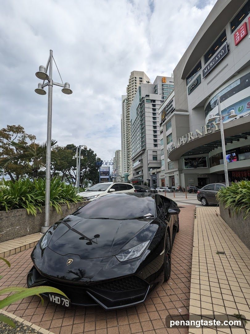 Black Lamborghini parked outside Gurney Plaza