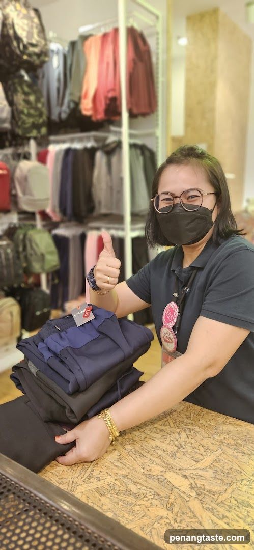 Store employee with folded pants