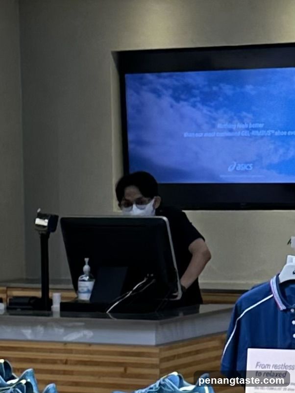 Store interior with employee at checkout