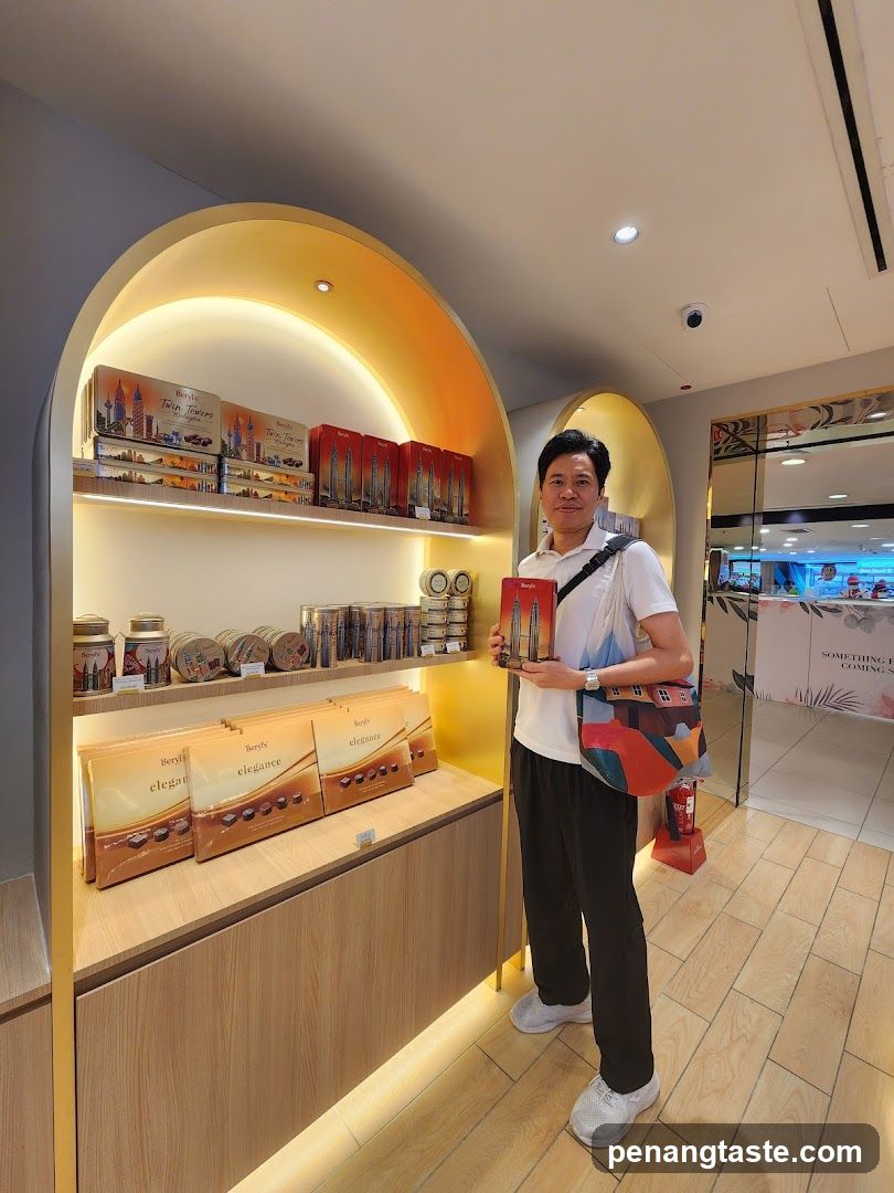 Man holding a box of chocolates in a store