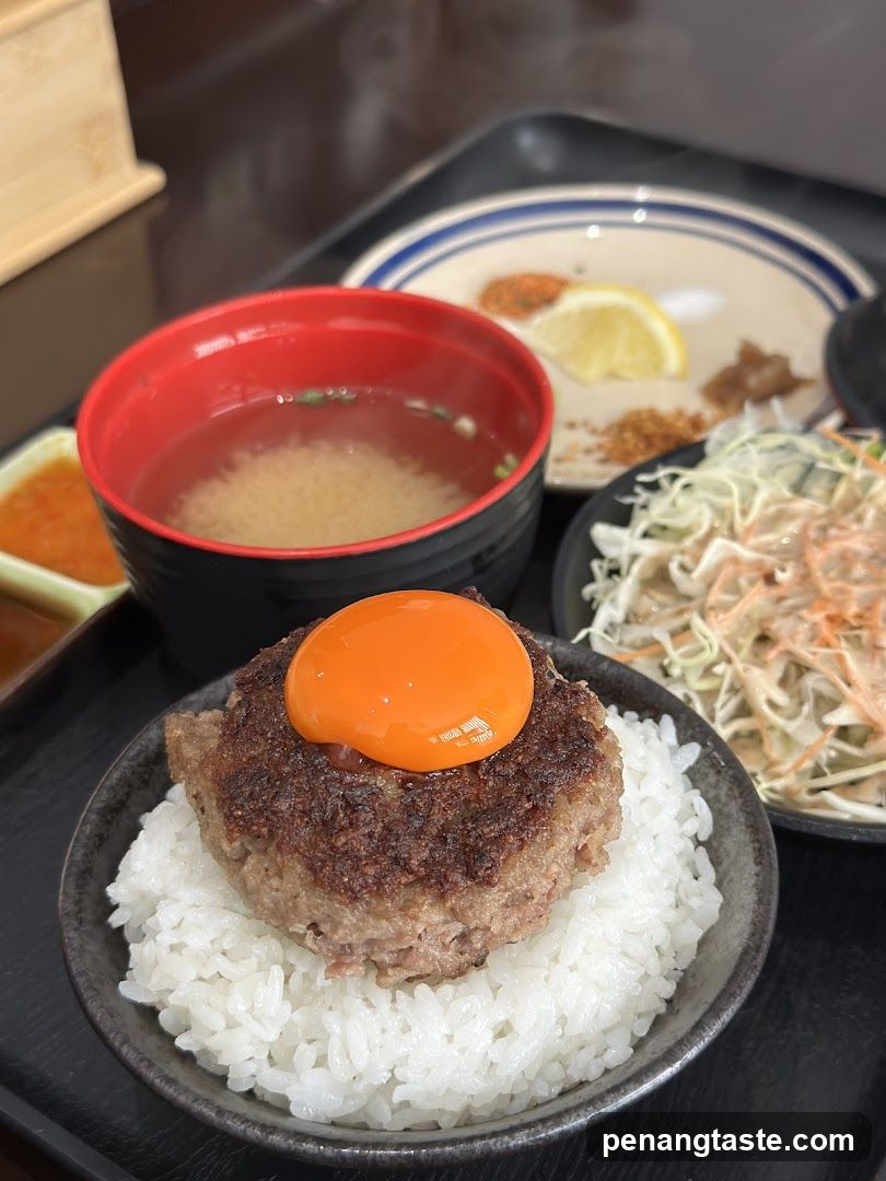 Hamburger Steak with Egg Yolk on Rice