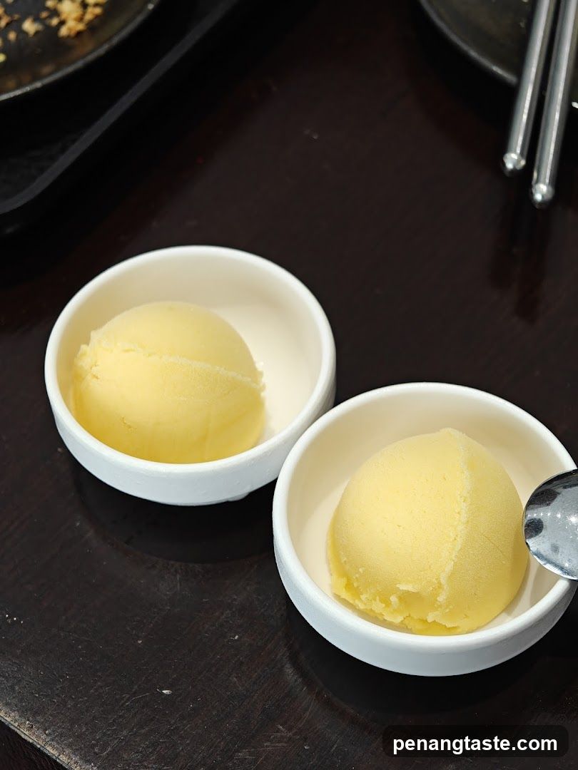 Two scoops of yellow ice cream