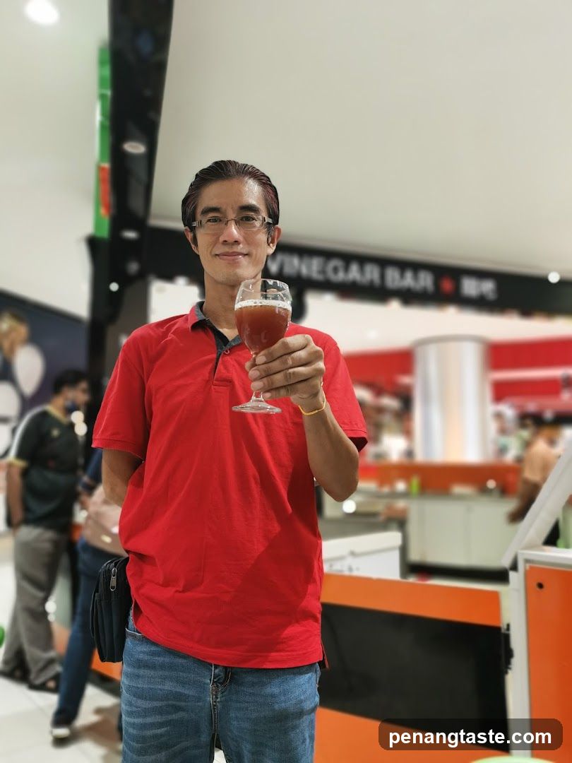 Man holding a glass of beer