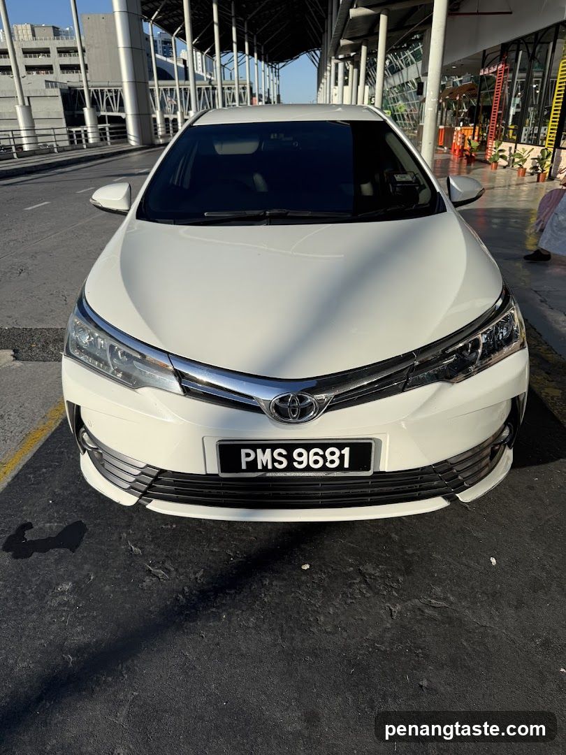 White Sedan with License Plate PMS 9681
