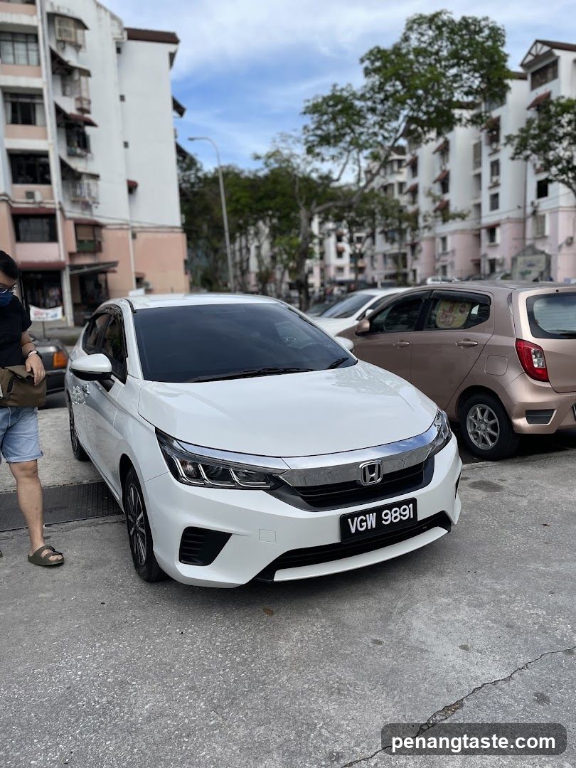 White Honda Car Parked Outdoors