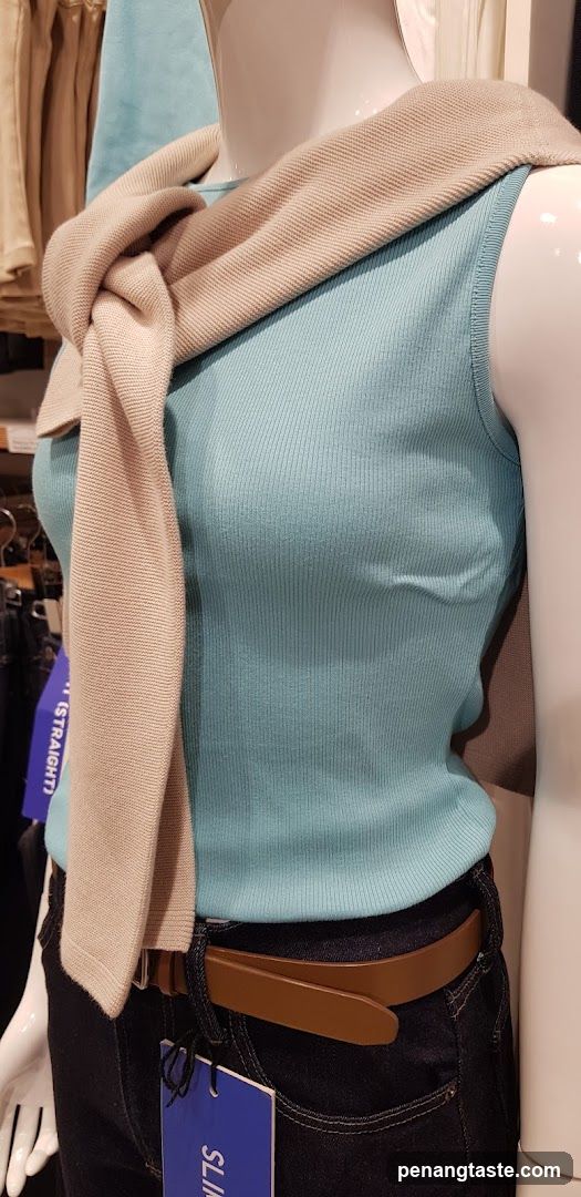 Mannequin wearing a blue tank top and jeans