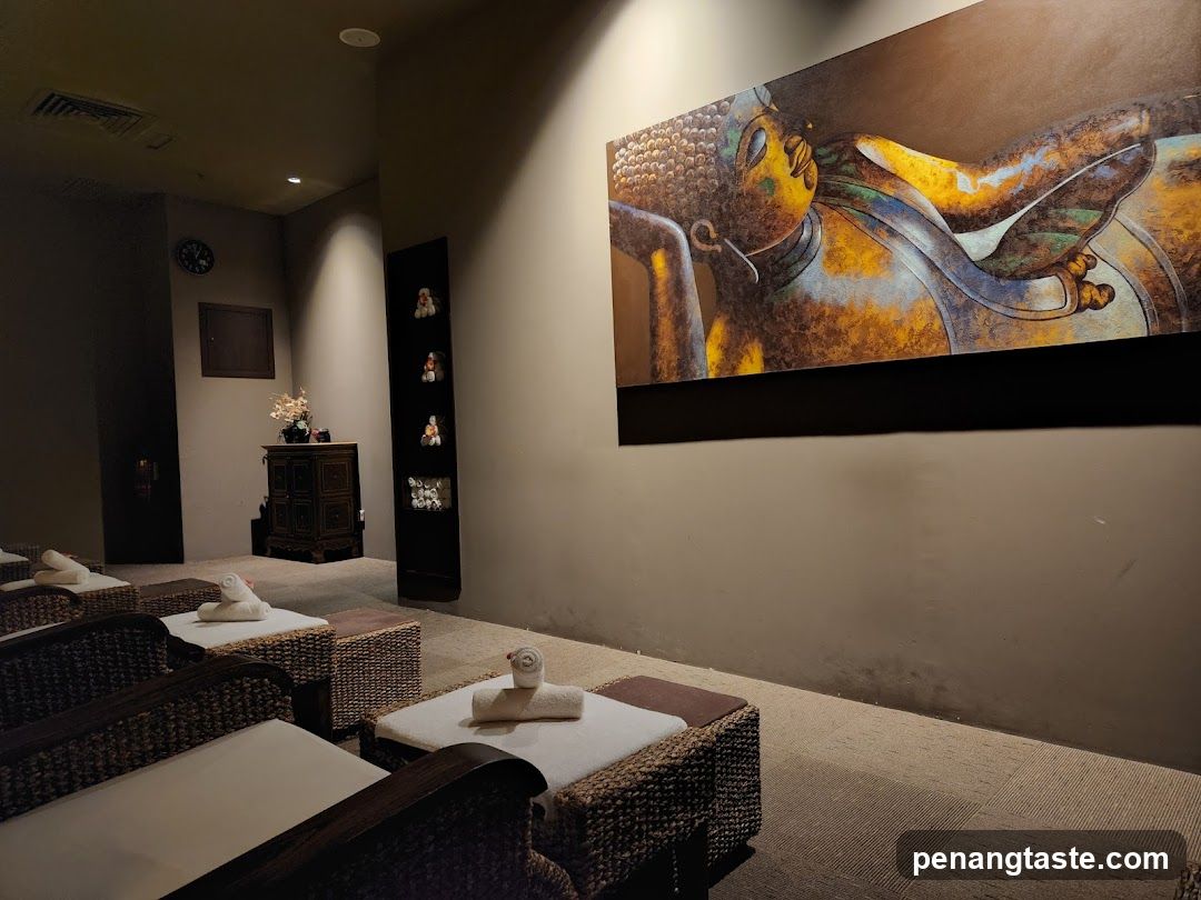 Spa waiting area with reclining chairs and Buddha artwork